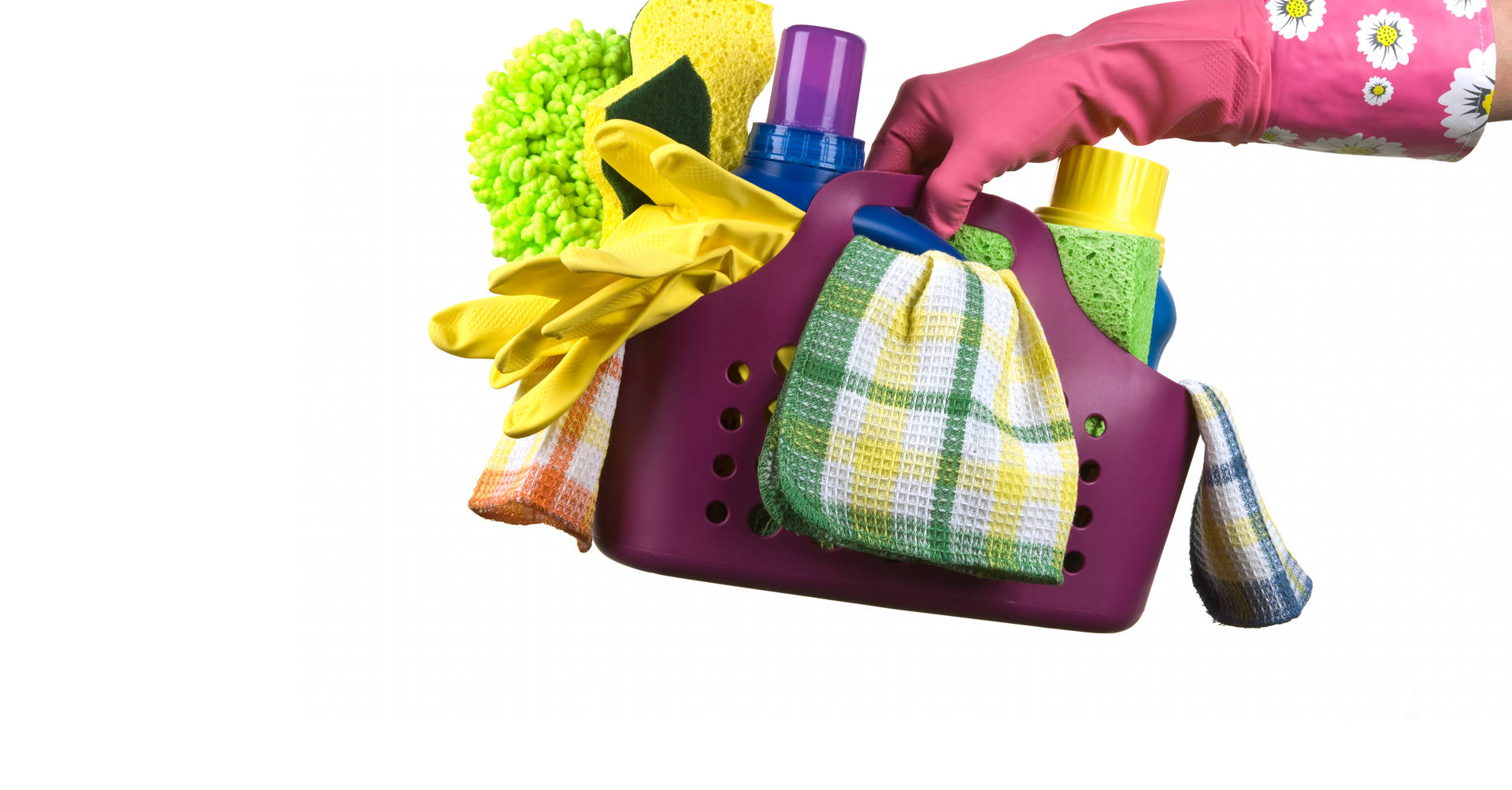 gloved hand holding cleaning supplies