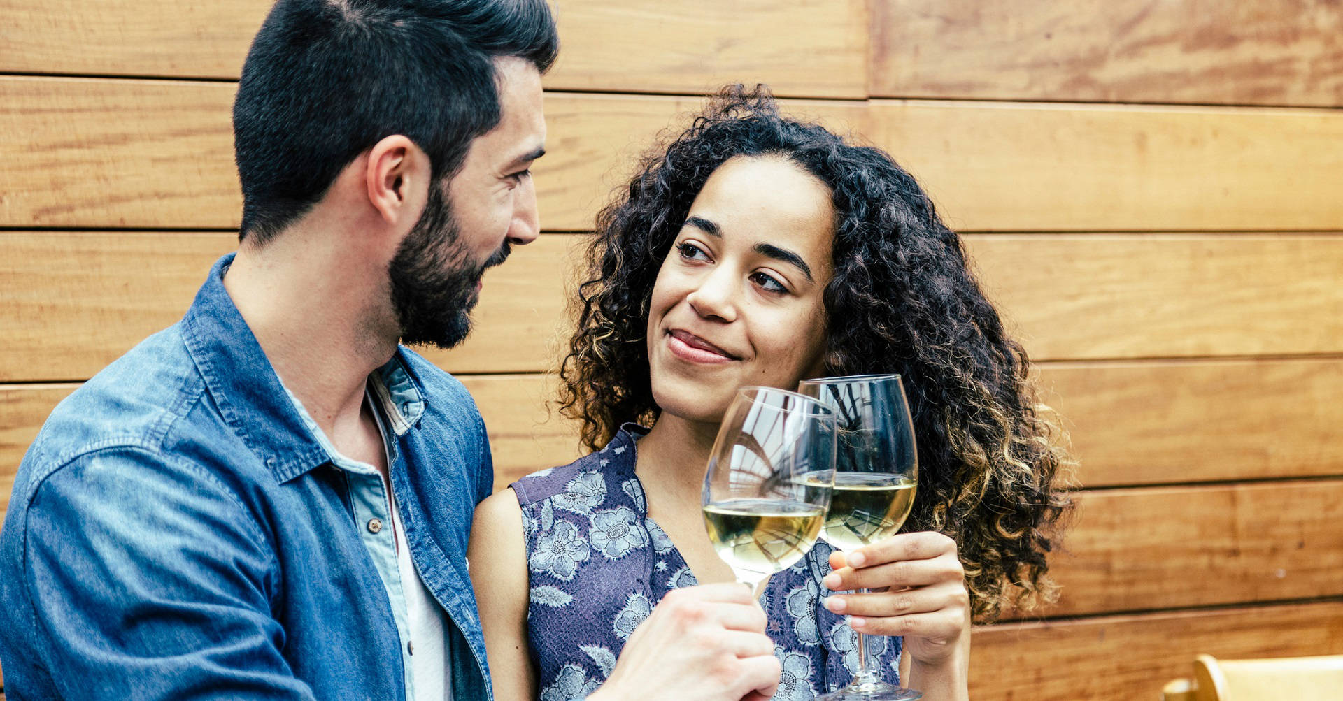 man and woman drinking wine