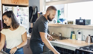 man and woman in the kitchen