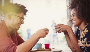 man and woman having coffee together