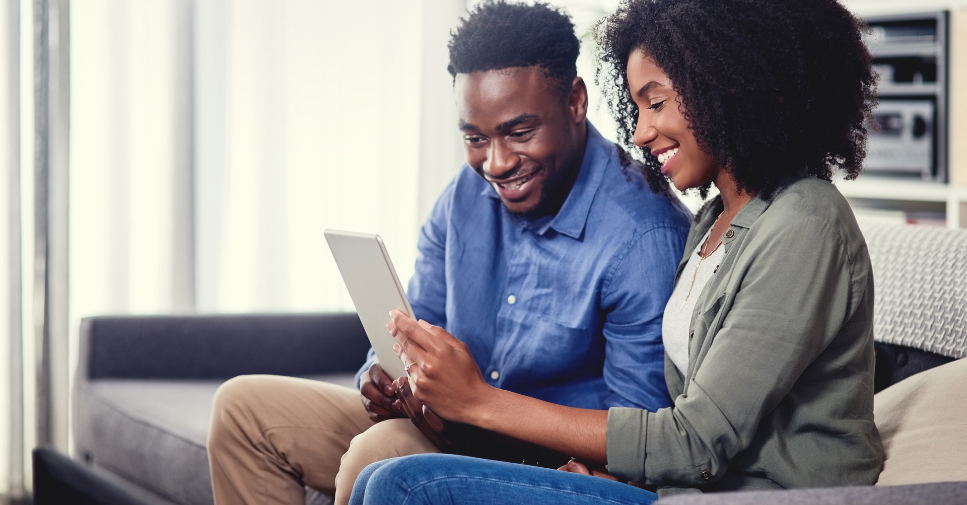 couple looking at tablet