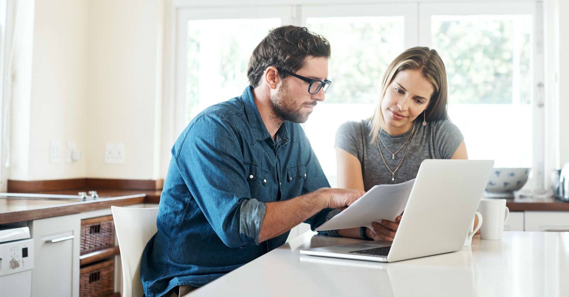 man and woman analysing document