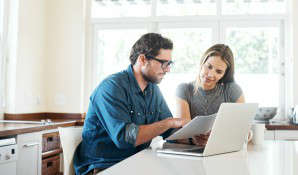 man and woman analysing document