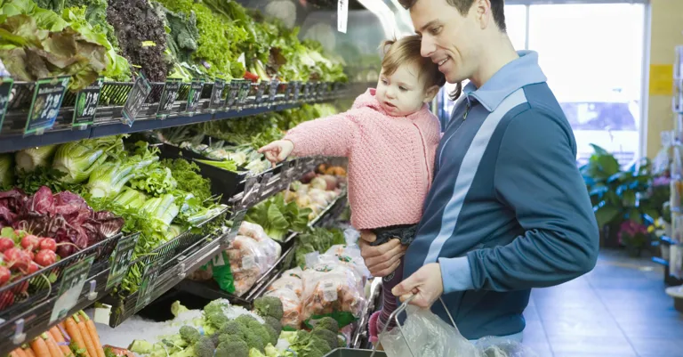 man and child shopping