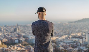 man standing looking over city