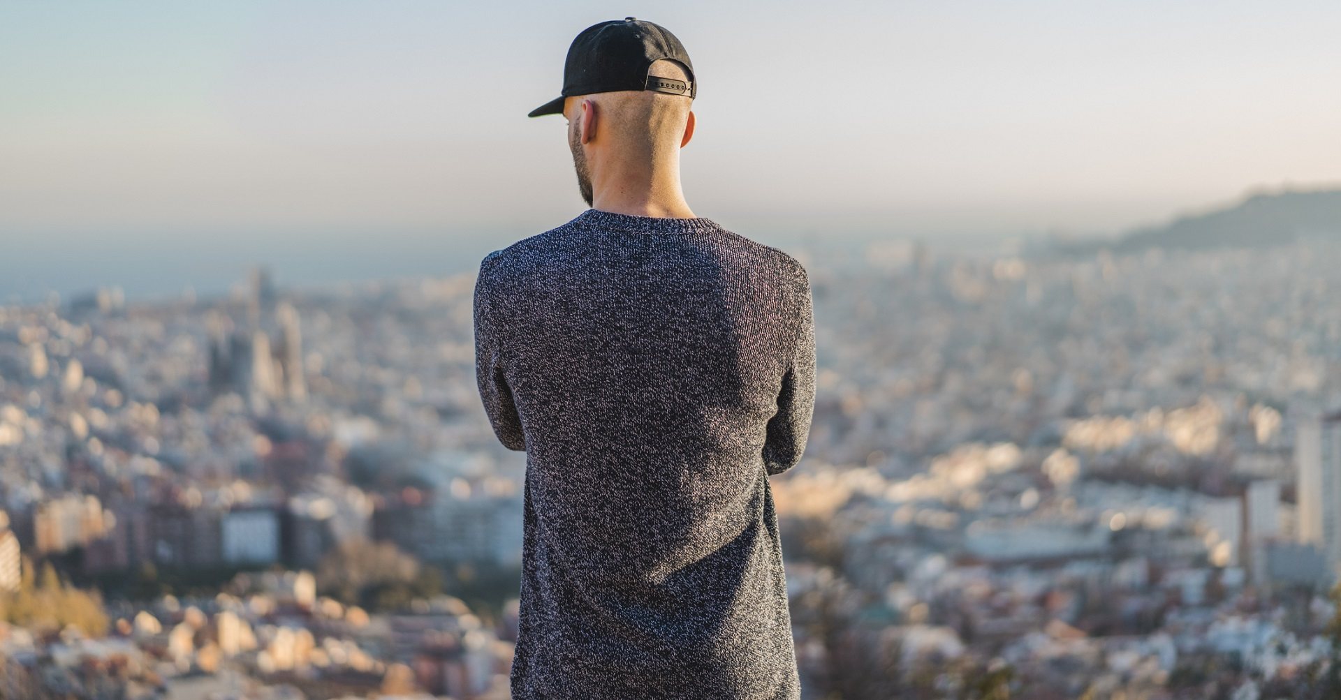 man standing looking over city