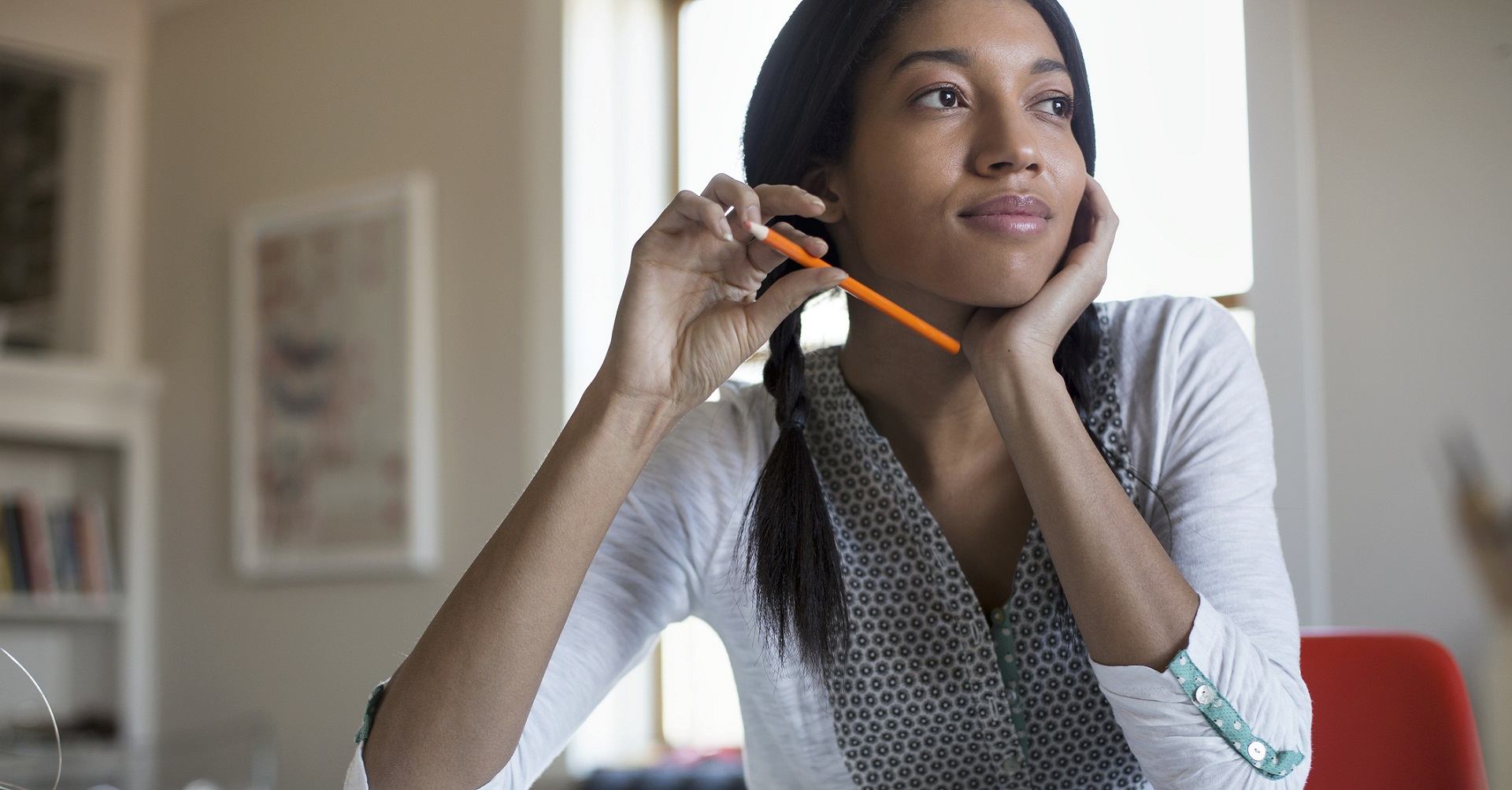 Woman sitting at desk doing taxes