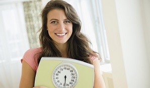 Woman holding scale