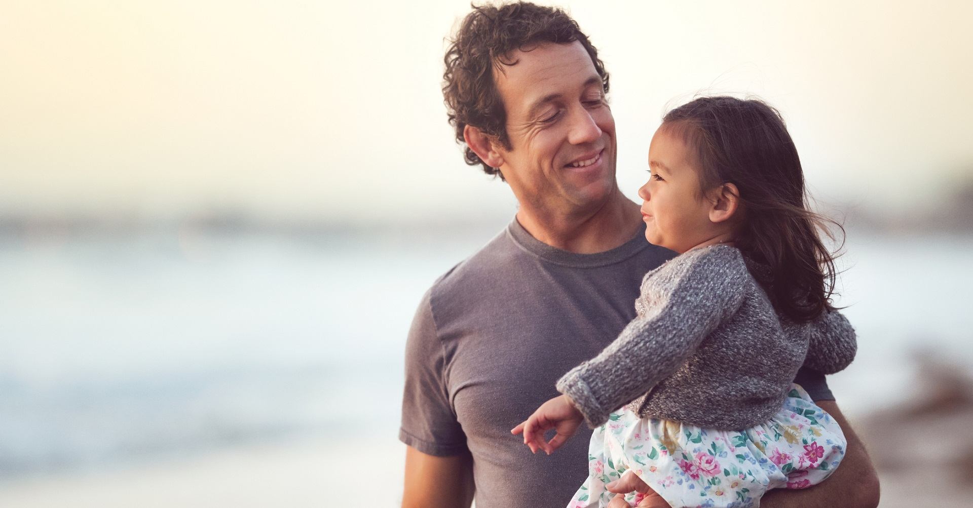 Dad with daughter on the beach