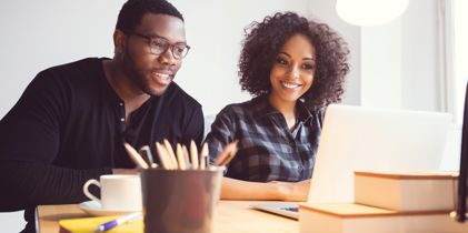 man and woman at desk