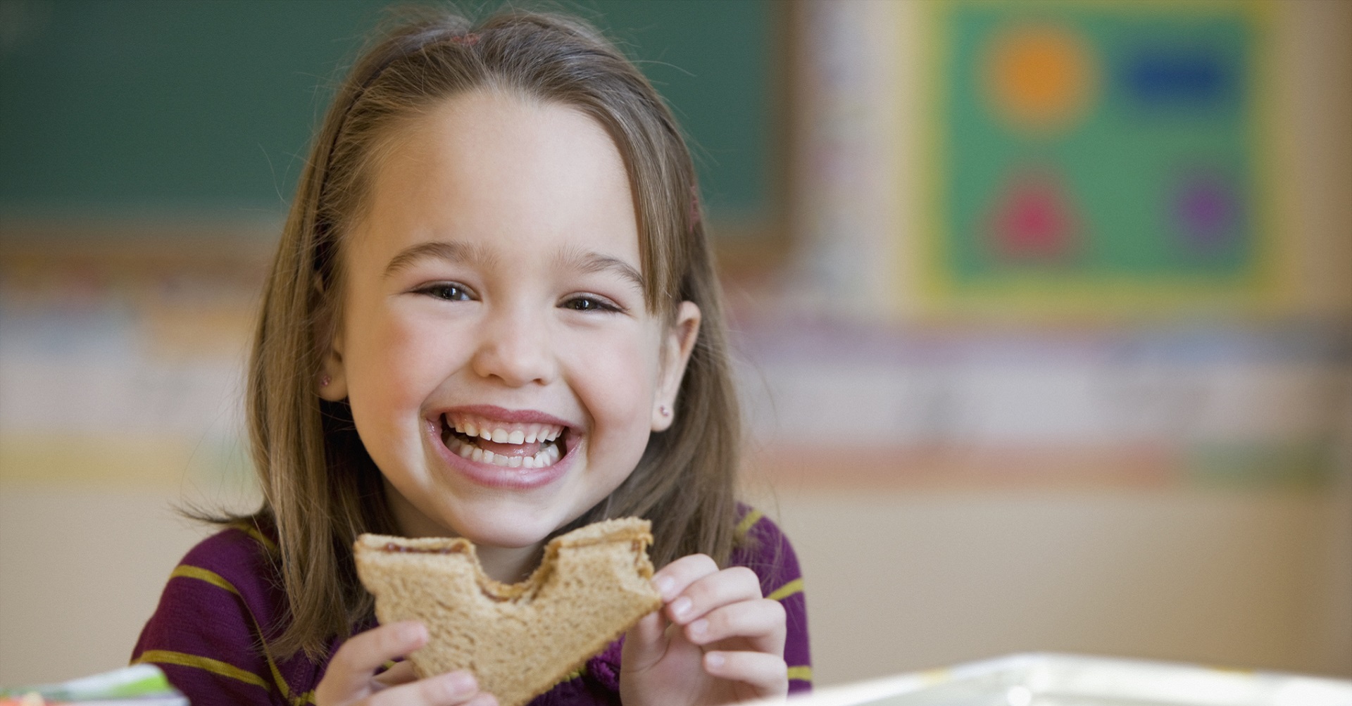 little girl eating lunch