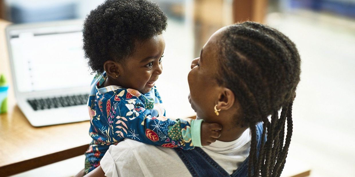 Mom and child looking at each other and smiling