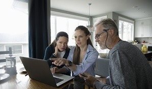 Family sitting at table planning