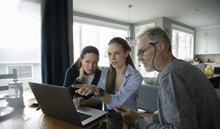 Family sitting at table planning