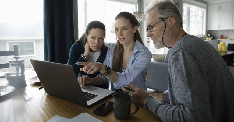 Family sitting at table planning