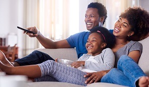 Family watching TV together