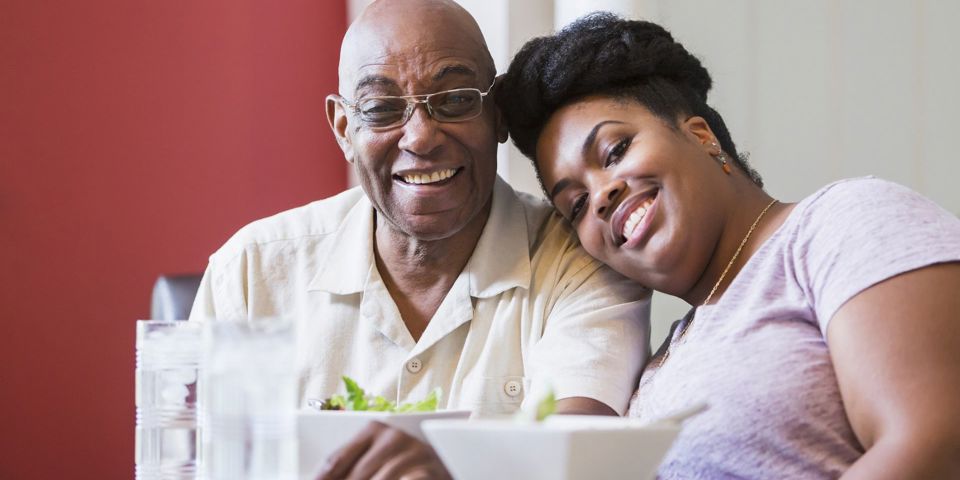 Father and daughter smiling