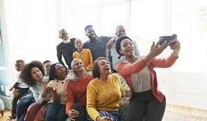 Woman taking selfie of her family