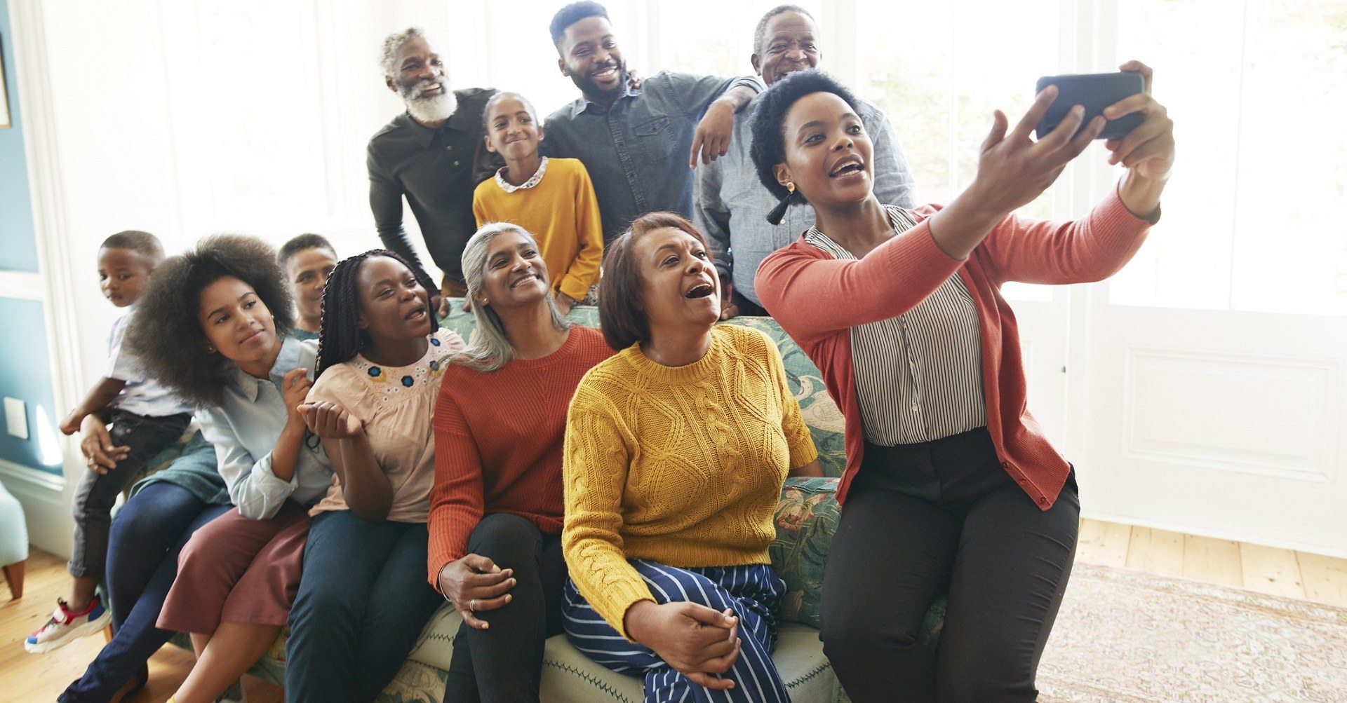 Woman taking selfie of her family