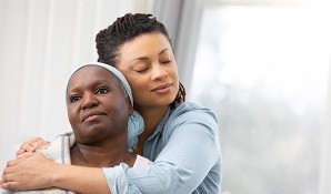 Daughter hugging mother