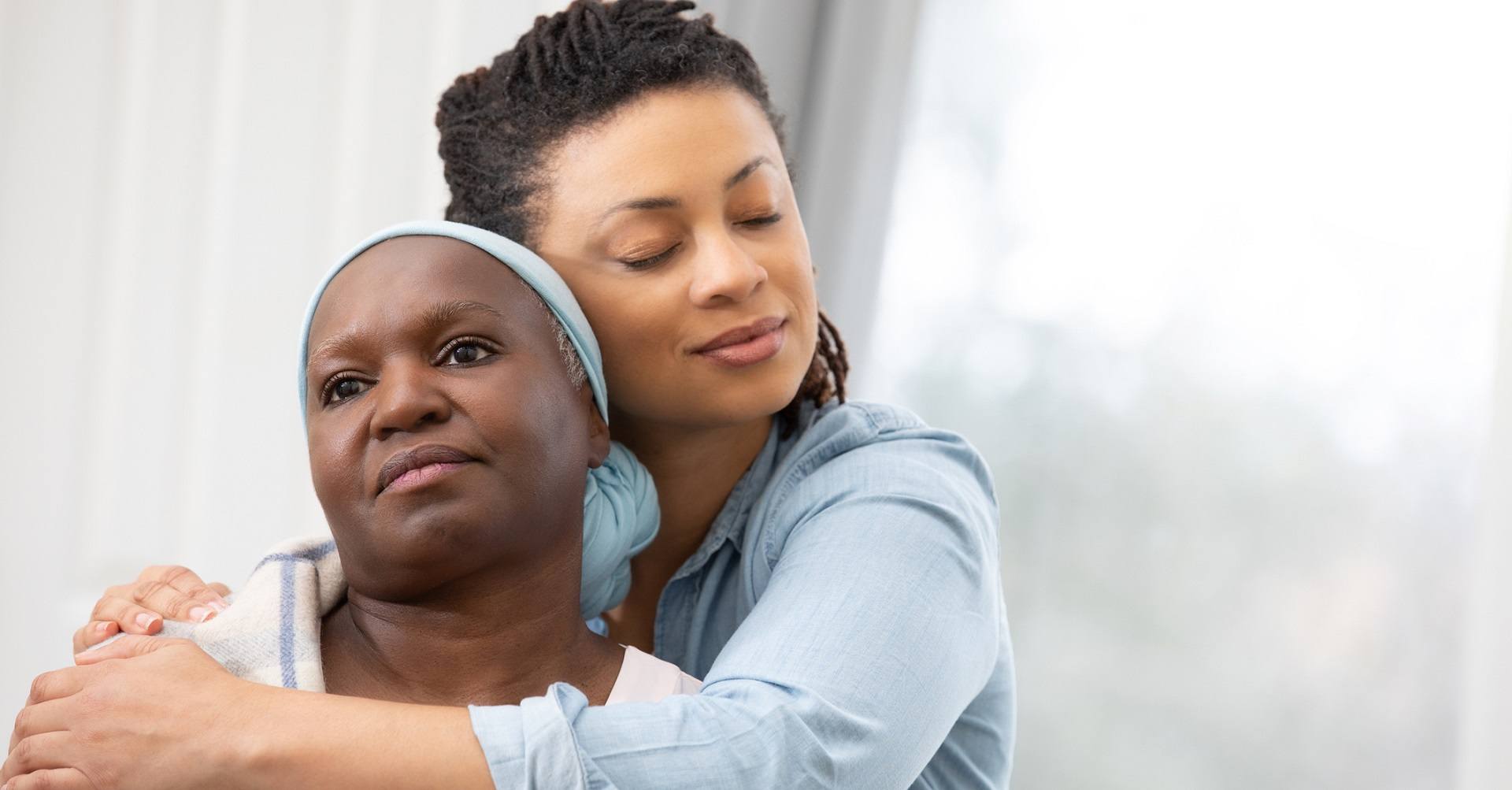 Daughter hugging mother