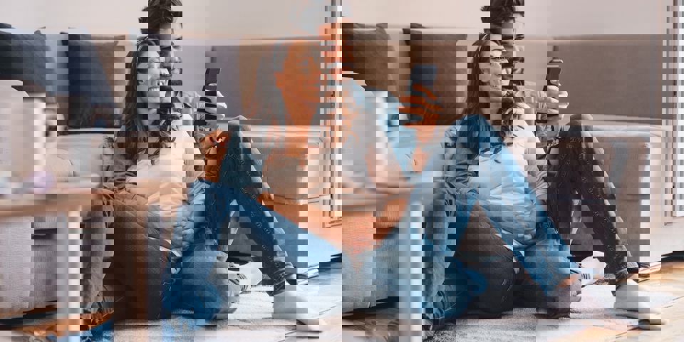 Couple sitting together on floor researching