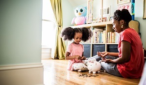 Mother with daughter counting coins