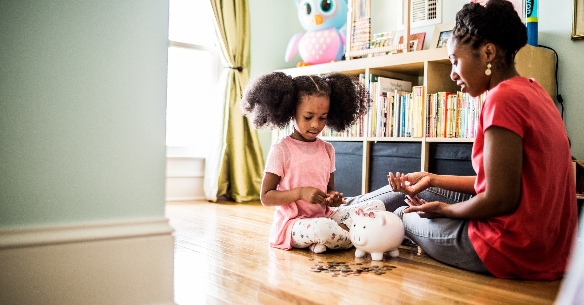 Mother with daughter counting coins