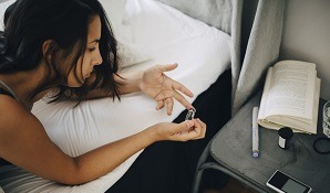 Woman taking blood sugar measurement