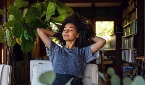 Woman sitting on couch relaxed