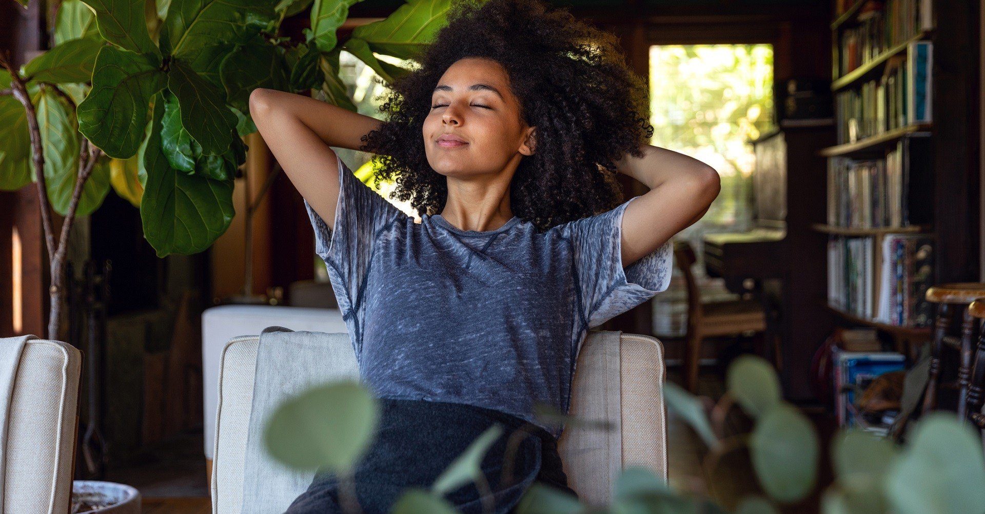 Woman sitting on couch relaxed