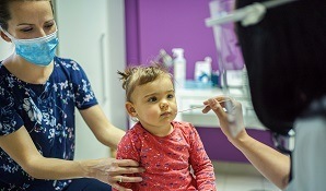 Child at doctor with mother
