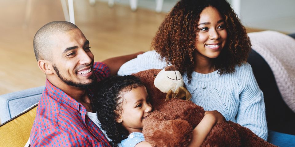 family sitting on couch