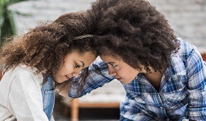 Mother talking to daughter