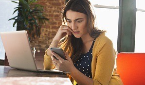 Woman sitting at work stressed