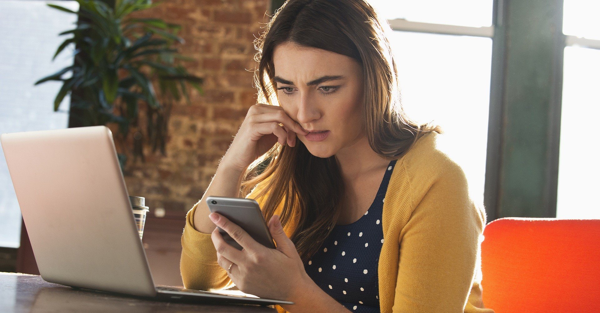 Woman sitting at work stressed