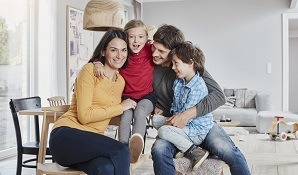 family sitting on couch