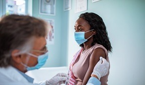 Woman at doctor getting a vaccine