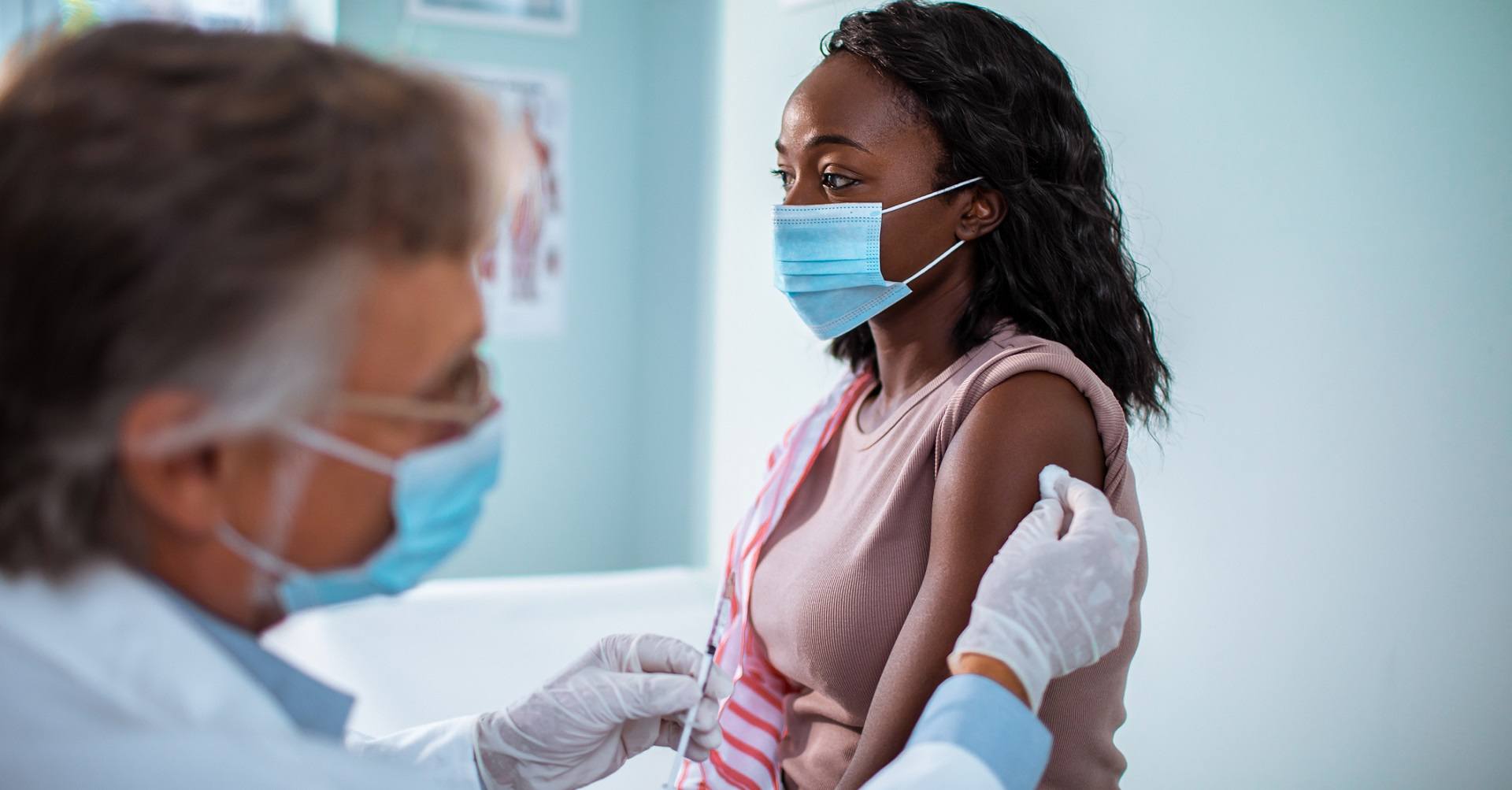 Woman at doctor getting a vaccine