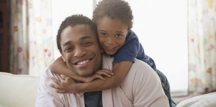 child hugging father