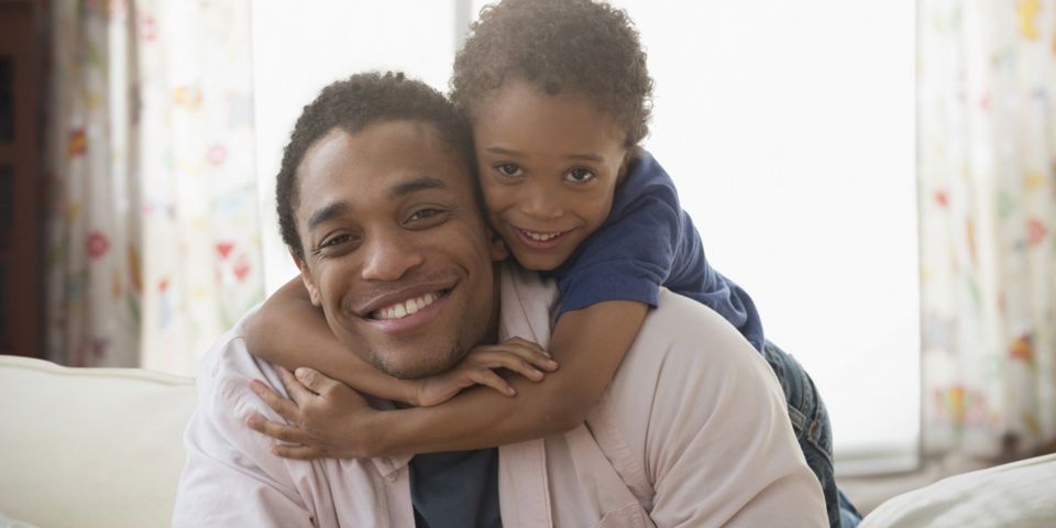 child hugging father