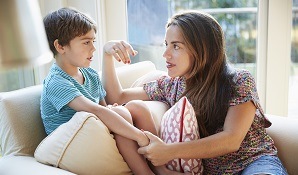Parent talking to child at home