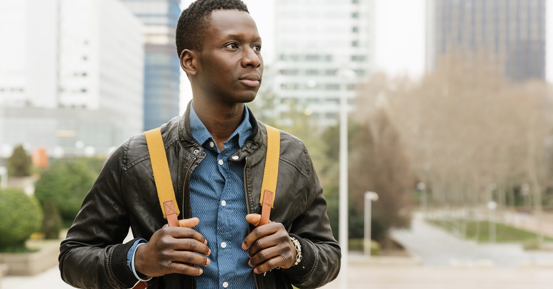 Young man walking through town