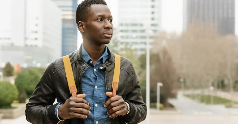 Young man walking through town
