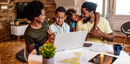 Parents with kids at computer