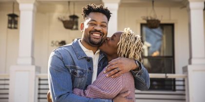 Woman kissing her husband