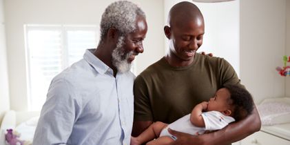 Father and son with baby