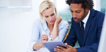 business man and woman at desk