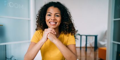 smiling lady sitting at desk