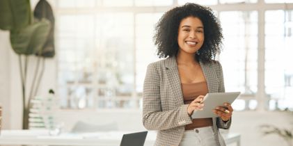 businesswoman on tablet in office